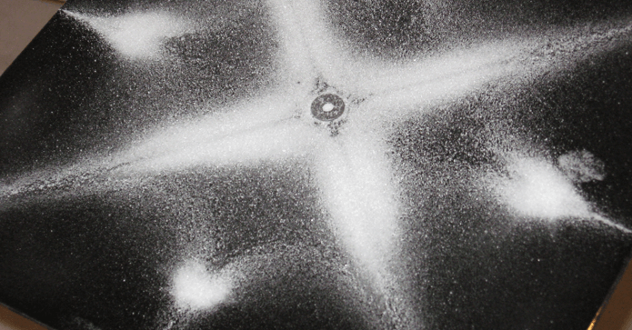 Why sound heals? Powder on a metal plate, attached to an oscillator.
